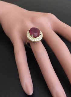 11.75 Carats Impressive Natural Red Ruby and Diamond 14K Yellow Gold Ring Suggested Replacement Value: $6,800.00 Total Red Ruby Weight is: Approx. 11.00 Carats (Lead Glass Filled) Ruby Measures: Approx. 14.00 x 11.00mm Natural Round Diamonds Weight: Approx. 0.75 Carats (color G-H / Clarity SI) Ring total weight: Approx. 7.8 grams Disclaimer: all weights, measurements and colors are approximate and may vary slightly from the listed dimensions or as seen in the image. All pictures are magnified to Luxury Ruby Ring For Formal Occasions, Luxury Oval Ruby Ring For Formal Occasions, Luxury Oval Ruby Ring For Anniversary, Formal Yellow Gold Ruby Ring, 14k Gold Ruby Ring For Formal Occasions, Luxury Hallmarked Ruby Ring For Formal Occasions, Elegant Ruby Ring With 17 Jewels, Luxury Red Ruby Gemstone Ring, Formal 14k Gold Ruby Ring Fine Jewelry