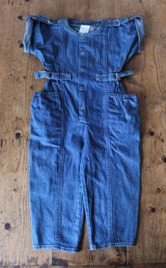 "VINTAGE 80's, great short sleeves overalls / jumpsuit, Indigo denim cotton fabric, large side pockets, metallic snap buttons and buckles. Brand \" Petit Diable \". Size 3 years Length 29,9\"  Vintage condition level 5, new old stock ( washed once ) We assess the condition of our vintage items on a scale from 0 to 5. Level 5 corresponds to an almost new vintage condition. Any defects are systematically reported. Even though in very good condition, vintage items may present imperfections due to their age, which mainly adds to their charm. I am fond of children wearing vintage clothes  They definetely look so cute   Vintage clothes are original, trendy, and often better manufactured than actual production ... It is also an opportunity for optimal recycling and a great way not to add to mass Dark Wash Buttoned Cotton Denim Jumpsuit, Retro Dark Wash Cotton Denim Jumpsuit, Fitted Spring Overalls Shortalls, Fitted Spring Shortalls Overall, Fitted Shortalls Overalls For Spring, Fitted Cotton Overalls With Button Closure, Spring Bib Front Fitted Overalls, Spring Fitted Bib Front Overalls, Summer Cotton Jumpsuits And Rompers With Belt Loops