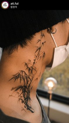 the back of a person's neck with a tattoo on it