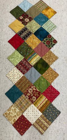 the quilt is laid out on top of each other