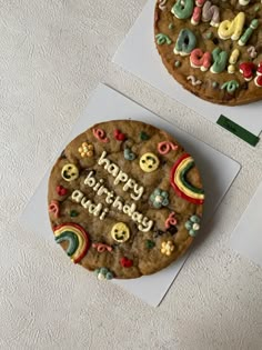 two cookies with happy birthday written on them