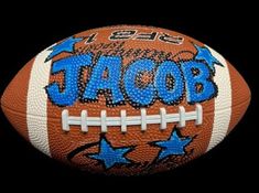 an orange and blue football with the words jabob on it, against a black background