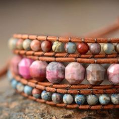 Introducing our 3 Strands Zen Fusion Leather Wrap Bracelet, crafted for the free-spirited souls who appreciate the beauty of handcrafted jewelry. This wrap bracelet is a fusion of leather and natural stones like rhodonite and jasper. Each stone has its own story to tell. Rhodonite, known for its soothing properties, and jasper, symbolizing grounding and stability, combine to create the balance that resonates with your inner energy. With an adjustable fit, you can tailor it to your preferred size Love So Pure, Wrap Armband, Leather Wrap Bracelets, Pink Rhodonite, Bohemian Jewellery, Jasper Bracelet, Wrap Bracelets, Bracelet Women, Pink Boho