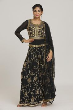 Black kurta with floral embroidery and tassels. Paired with flared pant and dupatta.
Components: 3
Pattern: Embroidered
Type Of Work: Floral
Neckline: Round
Sleeve Type: Full
Color: Black
Other Details: 
Curved hem
Tassels
Occasion: Mehendi and Haldi - Aza Fashions Black Kurta, Pant Set, Set For Women, Aza Fashion, Flare Pants, Fashion Set, Sleeve Type, Floral Embroidery, Black Floral