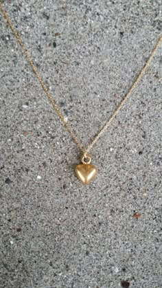 Tiny heart pendant. So cute and dainty can be worn every day with everything!The matte gold plated charm is a dainty 10mm long with a matte gold finish. It  has a delicate 14K gold fill chain with a gold filled clasp in back. Shown here in 17" length.*If you are unsure of the length you need, or would like to wear this item at different lengths, we now offer an adjustable length option! You can add an adjustable end to your necklace using this link: https://www.etsy.com/listing/791277751/necklac Cheap Delicate Chain Jewelry With Heart Pendant, Cheap Minimalist Heart Charm Necklaces, Cheap Gold Heart Necklace Gift, Cheap Minimalist Heart Pendant Necklace, Delicate Gold Heart Charm Necklace, Everyday Gold Charm Necklaces With Heart Beads, Everyday Gold Heart Beads Necklace, Everyday Gold Heart Necklace With Heart Beads, Everyday Gold Plated Heart Necklace