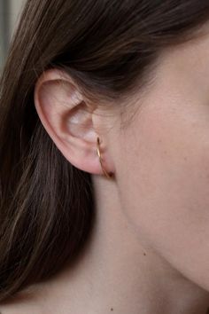 Minimal pair of earrings from " reflection " collection.An everyday wear pair of delicate sterling silver hoops  for pierced ears only.You may nee to adjust them a bit cause every ear is different Available in sterling silver and gold plated silver.This listing is for the silver hoops and not for the double gemstone earring , you will find our "marco" earrings here :https://www.etsy.com/listing/552590333/marco-925-st-silver-earrings?ref=shop_home_active_75This item is made to order ,and it may t Classic Everyday Ear Climbers With Matching Earrings, Sterling Silver Hoop Ear Cuff Single Earring, Dainty 14k Gold Ear Cuff For Everyday, Everyday 14k Gold Ear Climbers, Minimalist Ear Climbers For Gift, 14k Gold Ear Climbers With Ear Wire, Minimalist Everyday Ear Climbers, Everyday Pierced Ear Cuff, Dainty Hoop Wrap Earrings For Everyday