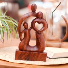 wooden figurines sitting on top of a table