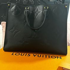 Almost New Beautiful Black Louis Vuitton Large Luxury Bags With Removable Pouch, Luxury Large Shoulder Bag With Top Carry Handle, Luxury Large Shoulder Bag With Removable Pouch, Large Luxury Satchel, Light Luxury Black Bag With Branded Hardware, Large Designer Satchel With Detachable Handle, Large Black Luxury Bag, Large Luxury Black Bag, Large Black Designer Bag