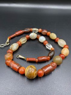 A beautiful old Ancient Antique Himalayan Indo Tibetan Necklace mala of carnelian Agate Sualamani , crystals beads The age of this beads are more than 1000 years old They were used in ancient times in prayers mala and in jewelry They were used as trade beads as well we provide fast and free shipping service world wide Antique Gemstone Beaded Necklace, Antique Gemstone Necklace With Round Beads, Traditional Carnelian Necklace With Polished Beads, Traditional Carnelian Gemstone Necklaces, Traditional Carnelian Gemstone Beads, Traditional Agate Gemstone Necklace, Antique Carnelian Necklace With Natural Stones, Antique Carnelian Necklaces With Natural Stones, Antique Amber Gemstone Beads Necklace