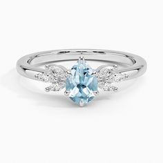 an oval blue topazte and diamond ring