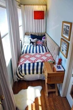 a bedroom with a bed, desk and pictures on the wall