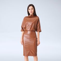 A faux leather dress featuring kimono style, a cowl neck, and a midi length. - Kimono style - Cowl neck - Knee length (midi) - Half sleeves - Color: caramel brown or black Fiber: 50% polyurethane, 50% polyester For size 2 US / 36 EU:dress length- 40,0 " (102 cm) Our model wears size 2 US and is 171cm/5'6" tall. You may feel free choosing the size. Just send us your measurements (bust, waist, hips, height). We will define your correct size. Leather Midi Dress For Fall, Fall Sheath Midi Dress For Date Night, Chic Pencil Midi Dress For Office, Sheath Midi Dress For Night Out In Fall, Fall Bodycon Dress For Work, Chic Leather Bodycon Dress, Spring Workwear Pencil Skirt Midi Dress, Spring Workwear Pencil Midi Dress, Chic Knee-length Faux Leather Dress