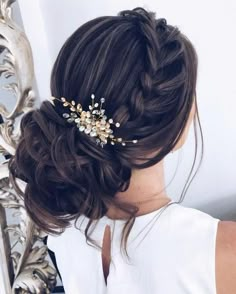 a woman wearing a hair comb with flowers in it