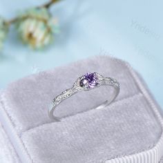 "Dainty Amethyst Engagement Ring / Purple Amethyst Promise Ring For Women / Vintage Solid 14K White Gold Ring February Birthstone bride ring ≫≫ Item Details Make every ring to order, all rings are handmade in the United States. Metal: Solid 10K & 14K & 18K Gold Gold Color: Rose gold, Yellow gold, White gold ➽ Center Stone This is a vintage amethyst engagement ring Main Ring: Round purple amethyst. The side stones are moissanites The accent stones of silver ring are white CZ --------------------- Elegant Lavender Birthstone Ring For Weddings, Purple Round Birthstone Ring For Wedding, Purple Brilliant Cut Rings For Promise, Purple Sapphire Promise Ring With Center Stone, Round Amethyst Birthstone Ring For Weddings, Lavender Cubic Zirconia Wedding Rings, Lavender Crystal Promise Ring, Purple Diamond Promise Ring With Prong Setting, Purple Diamond Ring With Prong Setting For Promise