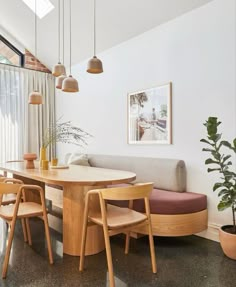 a living room with a couch, table and chairs