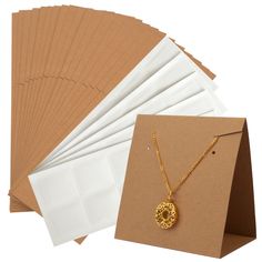 PRICES MAY VARY. HIGH QUALITY - Our Earring Display Cards are made of high quality paper material with pre-cut holes and pre-scored which are very easy to use. SIZE - Each standing earring card measures 8.5 x 5 x 8.5 cm/3.4 x 2 x 3.4 Inch. UNIQUE DESIGN - These display cards are the perfect gift for anyone who needs to display their earrings and necklace vertically. They stand securely on the table without the use of a display stand. EASY TO OPERATE - Each earring card is pre-scored so it's easy Packaging For Small Business, Earring Packaging, Small Business Jewelry, Necklace Pouch, Earring Display Cards, Business Jewelry, Sell Ideas, Jewelry Display Cards, Necklace Packaging