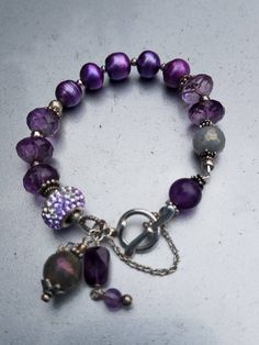 Beautiful faceted Amethyst and Pearl braclet. With safety chain. Adjustable Nickel-free Amethyst Bracelets, Elegant Purple Rondelle Bracelets, Elegant Nickel Free Purple Bracelets, Elegant Nickel-free Purple Bracelets, Elegant Lavender Bracelets With Faceted Beads, Elegant Purple Beaded Charm Bracelet, Lavender Jewelry With Faceted Beads, Elegant Faceted Amethyst Beaded Bracelets, Elegant Purple Metal Beaded Bracelets