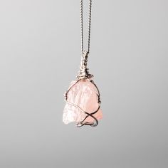 Rose Quartz Wire Wrapped Necklace  w 925 Sterling Silver Details: Gemstones: Rose Quartz Gemstone dimensions: 0.8"-1.2" (20-30 mm)  Material: 925 Sterling Silver Total necklace length: 16" /40 cm + extends to 18" /45 cm Rose Quartz, a gentle pink gem, embodies love and compassion. It resonates with the heart chakra, fostering emotional healing and self-love. Wearing Rose Quartz invites a sense of tenderness and inner harmony. ... Check out the full catalogue of raw wire wrapped crystal pendants Pink Rose Quartz Wire Wrapped Jewelry, Rose Gold Sterling Silver Pendant Crystal Necklace, Rose Quartz Pendant Jewelry Gift, Rose Quartz Natural Stones Jewelry Gift, Rose Quartz Natural Stones Jewelry For Gift, Rose Quartz Gemstone Pendant Jewelry, Minimalist Rose Quartz Gemstone Jewelry, Rose Gemstone Jewelry For Gift, Silver Rose Quartz Jewelry With Birthstone