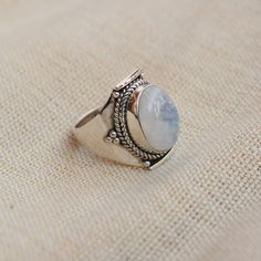 Gemstone - Natural Rainbow Moonstone Gemstone Size - 10x14 mm oval Metal - Sterling Silver natural AAA rainbow moonstone set with a sterling silver handmade ring Each Ring made with Precision and love, these rings are perfect for everyday use and a perfect accessory to wear at work. Rings can be customized on request and gemstone can be switched to any other as per requirement. Other beautiful designs uploaded with fabulous gemstones. kindly visit my store to view the complete collection. Feel f Silver Oval Moon Phase Ring, Silver Oval Ring With Moon Phase, Silver Oval Rings With Moon Phase, Oval Large Stone Moonstone Wedding Ring, Silver Moonstone Rings With Oval Cabochon, Silver Moonstone Ring In Oval Cabochon Shape, Sterling Silver Oval Rings With Moon Phase, Sterling Silver Oval Rings With Moon Phase Detail, Bohemian White Oval Crystal Ring