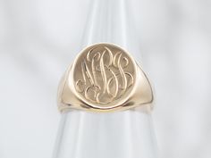 The engraving on this ornate antique signet ring was so well done, we opted to leave it be, and hope that we found someone with the initials "NBJ" who loves it as much as we do!Signet rings have a long history. Originally carved with a Family Crest, they were used to seal letters and documents by embossing the crest in wax. Over time they have evolved into day-to-day jewelry, which can be engraved with any crest, monogram, or initial one desires.Please note that this signet ring has its original monogram, unfortunately, this piece cannot be altered without affecting the quality of the piece, please feel free to contact us to help you find your perfect signet ring in your style and budget! Metal: 14K Yellow GoldTop Measurements: 11.2 x 14.2 mm, OvalMonogram: "NBJ" in French ScriptRing Size: Antique Engraved Signet Ring For Ceremonial Occasions, Victorian Signet Ring With Engraving Option For Wedding, Victorian Engraved Signet Ring For Wedding, Victorian Wedding Signet Ring With Engraving Option, Classic Engraved Signet Ring For Ceremonial Use, Classic Engraved Signet Ring For Ceremonial Occasions, Classic Engraved Ceremonial Signet Ring, Personalized Antique Yellow Gold Signet Ring, Antique Ceremonial Signet Ring With Engraving Option