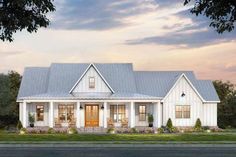 The standing-seam metal roof compliments the board and batten siding on the exterior of this Modern Farmhouse plan, complete with a charming wraparound porch and 2-car side-entry garage. Step through the double doors and past the foyer to find a gracious living room with a vaulted ceiling and fireplace. An oversized opening to the kitchen creates the popular open-concept layout, anchored by a prep island. Barn doors part to reveal a home office just off the living room, while the rear porch provides a sizable outdoor area for entertaining. The double garage shares the right side of the home with the master suite, laundry room, and walk-in pantry with a convenient mudroom entry from the garage with landing zone to keep everyone organized (and your floors clean!) Bedrooms 2 and 3 are nearly