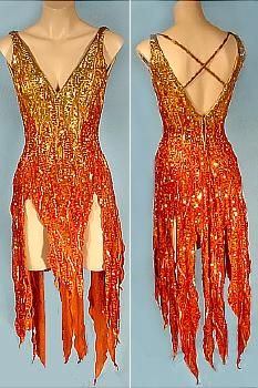 two mannequins dressed in orange and gold sequins with criss cross straps