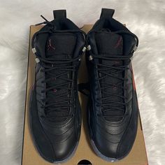 Air Jordan 12 Retro Black/Black - Crimson Black High-top Sneakers With Air Cushioning For Sports, Black Leather Lace-up Jordan Shoes, Custom Leather Sneakers With Air Max Cushioning, Black Leather Basketball Shoes With Laces, Black Low-top Jordan Shoes With Laces, Black Low-top Jordan Shoes, Black Jordan Shoes With Air Cushioning For Streetwear, Low-top Leather Basketball Shoes With Air Cushioning, Black Jordan Lace-up Shoes For Streetwear