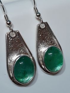 One of a kind, handcrafted, Zambian Emerald and sterling silver earrings.  Each earring measures about 43mm X 15mm. Artisan Silver Teardrop Earrings, Artistic Sterling Silver Teardrop Earrings, Artisan Teardrop Nickel-free Earrings, Artisan Teardrop Nickel Free Earrings, Handmade Silver Artisan Earrings, Artisan Drop Earrings, Handmade Artisan Silver Earrings, Silver Drop Artisan Earrings, Artisan Silver Drop Earrings