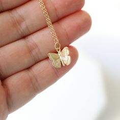 "Beautiful and lovely tiny butterfly necklace in gold color. Made of matte finished dainty butterfly pendant with gold plated skinny brass chain. Soft and warm. Great for gift, everyday or special occasion. Your item will ship in a gift box. Please feel free to contact me if you have any question. ♥ Length 15\" - 20\" ♥ Pendant 1/2\" x 3/8\" ♥ Gold plated over brass ♥ See more Rudiana Accessories Rudiana.etsy.com" Delicate Yellow Gold Butterfly Necklace, Dainty Gold-plated Yellow Gold Butterfly Necklace, Everyday Gold Necklace With Butterfly Charm, Everyday Gold Butterfly Necklace, Gold Butterfly Necklace For Everyday Wear, Gold Butterfly Necklace With Delicate Chain, Rose Gold Dainty Butterfly Necklace For Gift, Dainty Rose Gold Butterfly Necklace Gift, Delicate Yellow Gold Butterfly Necklace With Delicate Chain