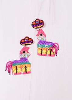 This party piñata earring is so bright and colorful! It is embellished with sequins and has a beaded sombrero. Dimensions: 3" long Adjustable Fun Party Earrings, Fun Dangle Earrings For Party, Handmade Beaded Earrings For Parties And Festivals, Party Earrings With Colorful Beads, Summer Party Beaded Dangle Earrings, Handmade Fun Earrings For Parties, Fun Handmade Party Earrings, Fun Handmade Earrings For Parties, Multicolor Beaded Earrings For Summer Party