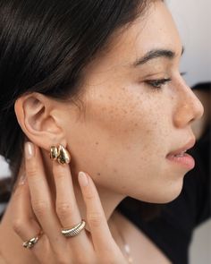 Flaunt your fierce fashion sense with these 14k Gold Bubbled Flat Hoop Earrings—golden, bold, and unapologetically stunning. Available in three sizes to match any vibe, slip them on and let your style do all the talking, because honey, these hoops are all about making an entrance. Outer Diameter: Approx. 14.6mm Inner Diameter: Approx. 11mm Width: Approx. 5mm Total Weight: Approx. 2.1 grams (per pair) Standard Production: 5-8 business days Rush Order Production: 2-5 business days Shipping: Select Flat Hoop Earrings, Fierce Fashion, Gold Bubbles, Earrings Golden, Personalized Necklace, Ring Bracelet, Fashion Sense, Ring Earrings, Final Sale