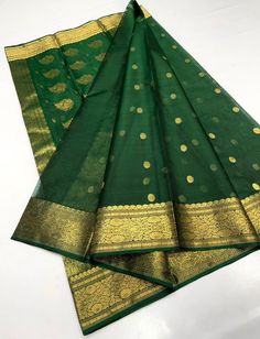 1.this is beautiful pure karan handwoven chanderi silk sari with with running blouse piece 2.this sari is 5.5 mt length  3.this is a very elegant looking sari for all occasions like weddings and other formal events  4.fall n pico is complimentary  5.blouse can be made as per the requirements of the clients with proper measurements.stiching charges will be extra  6.plz check the availability of the sari before placing the order Green Cotton Silk Lehenga With Zari Work, Gold Cotton Silk Sharara With Pallu, Designer Chanderi Dupatta With Tilla, Designer Chanderi Lehenga With Tilla Embroidery, Chanderi Anarkali Set With Tilla, Designer Wear Transitional Dupatta With Tilla, Traditional Sharara With Tilla For Designer Wear, Elegant Green Cotton Silk Lehenga, Traditional Tissue Silk Lehenga