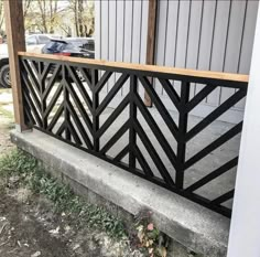 a black metal railing on the side of a building