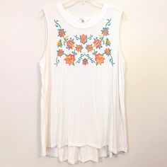 Gently Used. Got It Brand New, But Only Wore It Twice Last Summer. White Tends To Wash Me Out, Which I Didn't Know Until I Wore This Top. No Rips, Stains, Fraying Or Pilling. White Flowy Blouse, Sleeveless, With A Brightly-Colored, Floral Embroidered Front. Material Is Rayon And Spandex, And Is Stretchy. Women's Size Extra Large Machine Washable Measurements: 22 Inch Bust 29.5 Inch Length Don't Like The Price? Bundle This Item With Any Other Items Under The 5/$30 Tag To Get The Discount, Or I'm Spring White Tank Top With Floral Embroidery, White Floral Embroidery Tank Top For Spring, White Embroidered Tank Top For Spring, Casual Embroidered Tank Top For Summer, Floral Embroidered Tank Top For Spring, Spring Floral Embroidery Tank Top, Floral Embroidered Tank Top For Summer, Summer Casual Tank Top With Floral Embroidery, Embroidered Tank Top For Summer