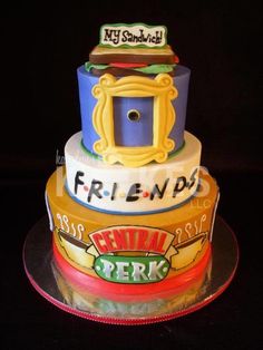 a three tiered cake with the words friends written on it's top and bottom