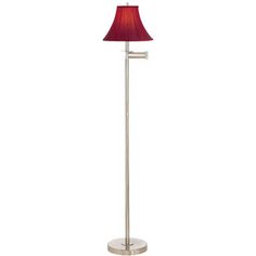 a floor lamp with a red shade on the base and a white light behind it