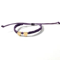 This bracelet is made of purple waterproof rope and two gold plated heart charm. Gold Heart Bracelet With Sliding Knot, Trendy Purple Braided Bracelet Gift, Trendy Purple Braided Bracelet For Gift, Gold Heart-shaped Adjustable Friendship Bracelets, Gold Heart Friendship Bracelets Adjustable, Gold Heart Friendship Bracelets With Sliding Knot, Adjustable Double Heart Yellow Gold Bracelets, Adjustable Double Heart Yellow Gold Bracelet, Everyday Gold Friendship Bracelets With Heart Charm