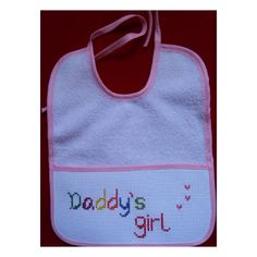 "Looking for a unique gift for a newborn baby or a toddler? \"Daddy's Girl\" A finished Handmade Cross Stitch bib for a baby boy/ baby girl Light pink/ blue trim boarder that ties behind the neck. Perfect as a nursery, shower or birthday present and as a gift for new Daddy. Size: 10'' x 8.5'' Stitched with DMC floss and Aida Fabric.   Handmade in smoke free home. Don't forget to leave me a review. Please message me with any questions or any personalized orders!" Personalized Cotton Bib As Gift, Cute Pink Bib As A Gift, Cute Pink Bib For Gift, Cute Pink Bib As Gift, Cute Handmade Cotton Bib, Pink Cotton Bib As A Gift, Cute Handmade White Bib, Pink Cotton Bib As Gift, Cute White Handmade Bib