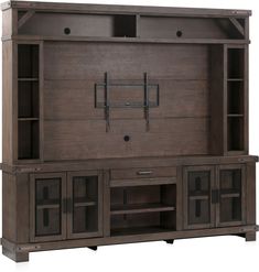 the entertainment center is made out of wood and has two doors on each side, one with