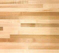 a close up view of a wood floor with different lines on it and one piece missing