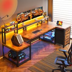 a computer desk with an illuminated monitor and speakers on it, next to a chair