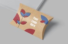 a brown paper bag with blue and red flowers on the front is open to reveal your logo here