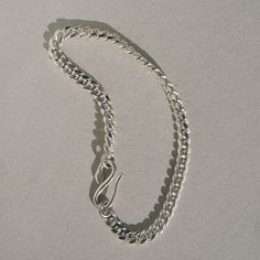 Inspired by the Roman “Good Goddess” Bona Dea, who was associated with serpents and snake-charming. A dependable curb chain bracelet. DETAILS hand cast snake clasp in sterling silver 4.3 mm sterling silver curb chain Choose 6.5 or 7 inches Everyday Silver Curb Chain Bracelets, Everyday Sterling Silver Curb Chain Jewelry, Everyday Sterling Silver Bracelet With Curb Chain, Sterling Silver Curb Chain Bracelet For Everyday, Sterling Silver Link Bracelet With Curb Chain For Everyday, Everyday Sterling Silver Cuban Link Bracelet With Curb Chain, Sterling Silver Cuban Link Jewelry For Everyday, Minimalist Sterling Silver Chain Bracelet With Curb Chain, Everyday Sterling Silver Cuban Link Jewelry