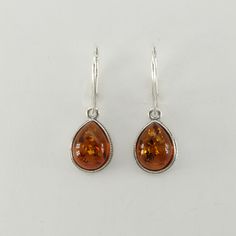 These is a beautiful pair of Sterling Silver Earrings with Baltic Amber. The earrings are made out of solid 925 Silver and there is no nickel or other substances causing most allergies. This makes the earrings hypo allergenic. Size of one Earring in total - with the hook - is  3.2 x 1.1 cm or  1.26 x 0.43 inch You will receive the item in a gift box - perfect to surprise someone or yourself. Usually we ship on the same day we receive the payment for the order. We want you to be happy with your p One Earring, Happy Customer, Le Crochet, Leverback Earrings, Baltic Amber, The Hook, To Be Happy, Cognac, Sterling Silver Earrings