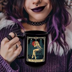 a woman with purple hair holding a black coffee mug in front of her face and wearing a choker