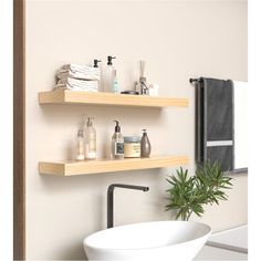 two wooden shelves above a white sink in a bathroom