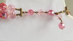 "This 1940's-50's TWO ( 2 ) STRAND CRYSTAL CHOKER NECKLACE was created with IRIDESCENT CRYSTAL BEADS in two ( 2 ) shades of PINK/ROSE. HANDKNOTTED with the shortest row measuring approximately 16 \" long . The color of this necklace is rare & the necklace is in VERY GOOD-EXCELLENT VINTAGE CONDITION. ( see photos for sizes & details ) Questions ? Please call 1-207-865-6191." Crystal Choker Necklace, Iridescent Crystal, Bangle Bracelet Set, Statement Choker, Black Bead Necklace, Crystal Choker, Shades Of Pink, Pink Crystal, Wedding Necklace