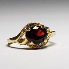 Gorgeous gold-plated faceted Garnet Crystal Ring-  January birthstone- with dazzling crystals.  size 9.75. It shines like real gold. GREAT Gift! No Tarnish It will come in a gift bag Gold Crystal Ring With Birthstone For Jewelry Making, Formal Gold Garnet Birthstone Ring, Gold Crystal Ring With Gemstone Accents For Formal Occasions, Gold Faceted Ruby Ring For Anniversary, Gold Garnet Birthstone Ring With Center Stone, Gold Ruby Ring With Gemstone Accents, Gold Ruby Ring With Gemstone Accents For Anniversary, Gold Faceted Ruby Ring, Gold Oval Crystal Birthstone Ring