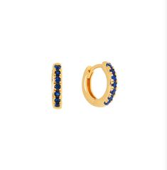 "Trendy small  \"huggies\" hoop earrings gold with set sapphire blue cubic zirconia.  Dainty and sleek.  Our special charms can be bought to be added on to these hoops to create your own customized earring.  18K gold over brass.  get or give your own personalized jewellery.  Sold as a pair  10 mm outer diameter 7mm inner diameter  Material: Cubic zirconia, 18K goldplated brass  Hypo-allergenic. Tarnish-resistant and waterproof." Blue Huggie Hoop Earrings, Blue Small Hoop Huggie Earrings, Blue Small Hoop Huggie Earrings For Everyday, Blue Hoop Huggie Earrings Gift, Blue Huggie Hoop Earrings For Gift, Blue Huggie Hoop Earrings As Gift, Blue Minimalist Hoop Huggie Earrings, Minimalist Blue Huggie Hoop Earrings, Blue Minimalist Huggie Hoop Earrings