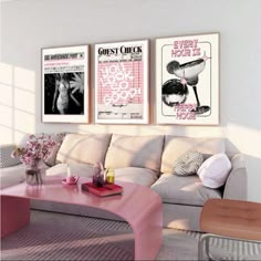 a living room filled with furniture and posters on the wall above it's coffee table